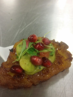 A picture of Tapas -- Plantain with a pomegranate guacamole.