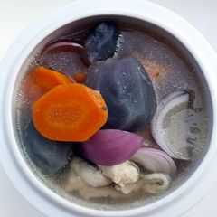 A picture of Black Potato In Chicken Soup.