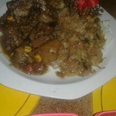 A picture of Beef stew with vegetable mix.