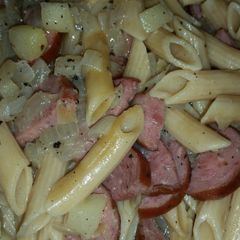 A picture of Kielbasa, onion, and apples oh my!.