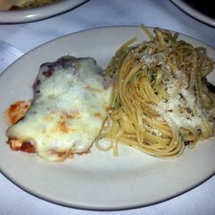 A picture of Chicken Parmesan and spaghetti.