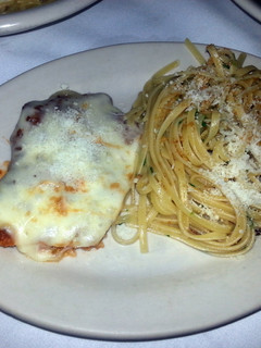 A picture of Chicken Parmesan and spaghetti.