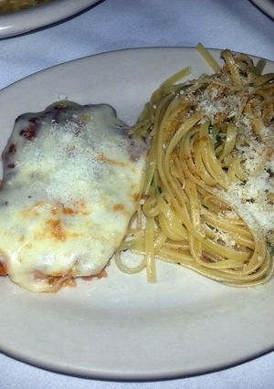 A picture of Chicken Parmesan and spaghetti.
