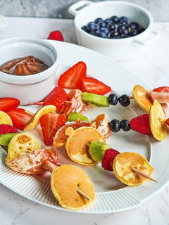A picture of Pancake fruit skewers.