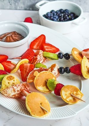 A picture of Pancake fruit skewers.
