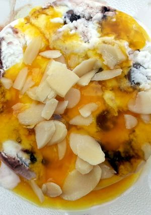 A picture of Ice Cream With Passion Fruit Coulis Dessert.