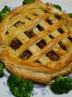 A picture of Meat Pie with Mozzarella Cheese.