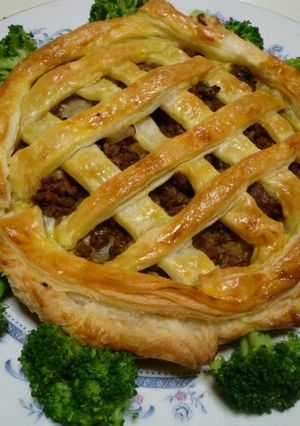 A picture of Meat Pie with Mozzarella Cheese.