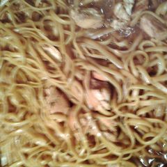 A picture of noodles with chicken.