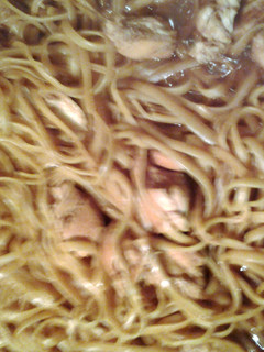 A picture of noodles with chicken.