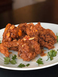A picture of Crunchy Fried Chicken with Sweet and Spicy Drizzle.