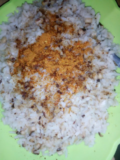 A picture of Rice and beans cooked with crayfish.