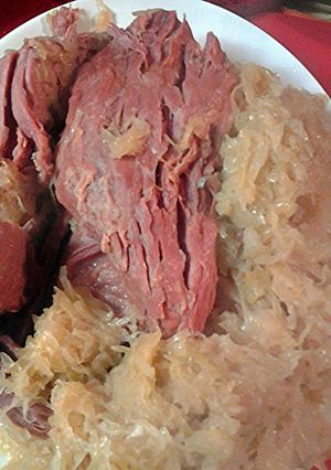 A picture of cornbeef brisket in sauerkraut.