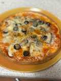 Pizza con champiñones