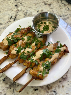 Una foto de Pinchos de pollo estilo Thai