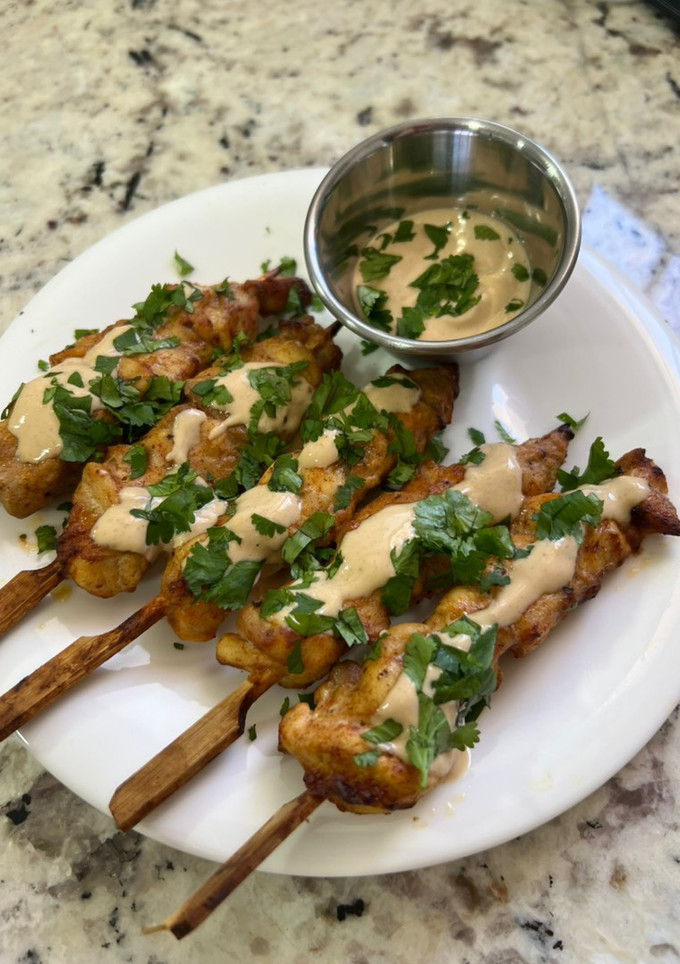 Una foto de Pinchos de pollo estilo Thai