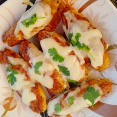 A picture of Chicken Cheese Kabab With White Sauce.