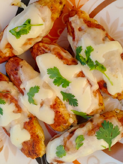 A picture of Chicken Cheese Kabab With White Sauce.