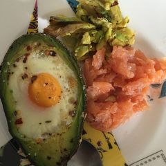 A picture of Baked avocado eggs with salmon for breakfast.