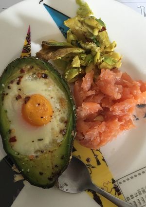 A picture of Baked avocado eggs with salmon for breakfast.