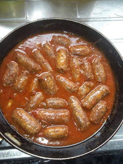 A picture of Sausage in a sauce.