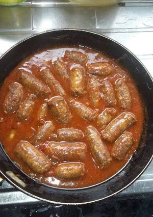 A picture of Sausage in a sauce.