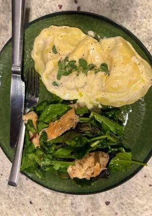 A picture of Lobster Ravioli with Cream Butter Sauce and Lemon Pepper Grilled Chicken.