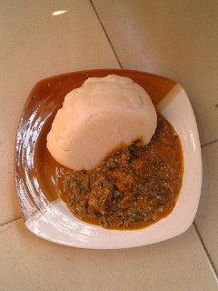 A picture of Groundnut soup and cassava swallow.