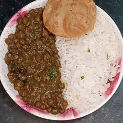A picture of Kala chana palak -Semi dry masala sabji.