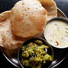 A picture of Puri Batata Bhaji Sevai Kheer.