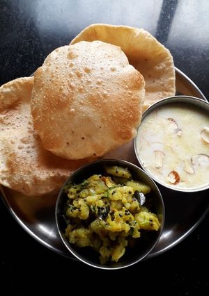 A picture of Puri Batata Bhaji Sevai Kheer.
