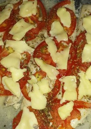Una foto de Merluza a la pizza