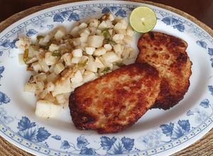 Una foto de Milanesa de pollo con queso parmesano