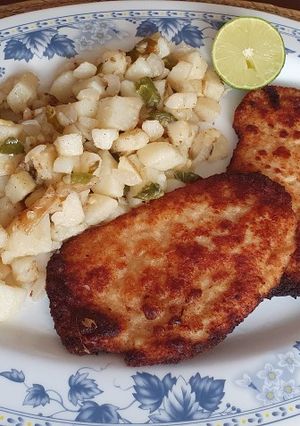Una foto de Milanesa de pollo con queso parmesano