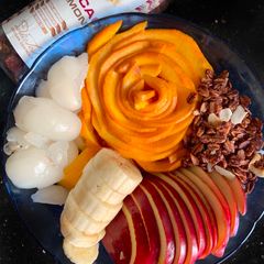 A picture of Granola with Rambutan & other fruits.