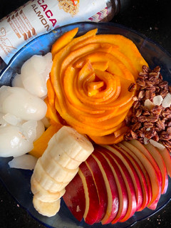 A picture of Granola with Rambutan & other fruits.