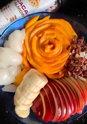 A picture of Granola with Rambutan & other fruits.