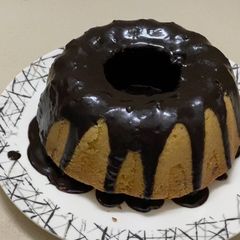 A picture of Bunt pan pound cake with chocolate ganache.