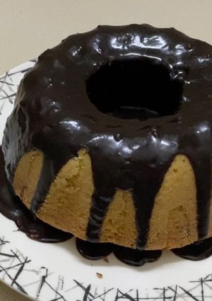 A picture of Bunt pan pound cake with chocolate ganache.
