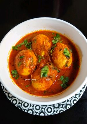 A picture of Egg Curry With Curd.