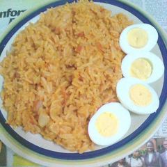 Jollof rice with boiled eggs A picture of Jollof rice with boiled eggs.
