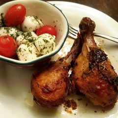 Mozzarella cheese with tomato Caprese salad and roasted chicken A picture of Mozzarella cheese with tomato Caprese salad and roasted chicken.