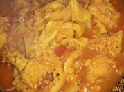 Una foto de guiso de mondongo con arroz