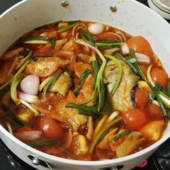 A picture of Salmon in Onion and Tomato Sauce.