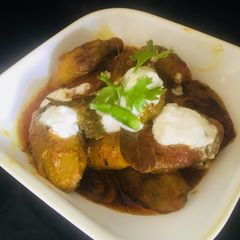 A picture of Padwal with dahi and poshto.