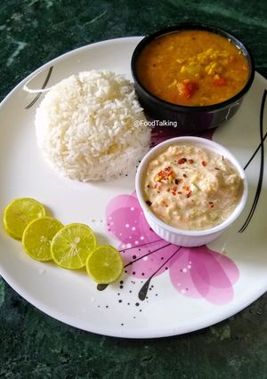 A picture of Green Papaya, Moong Dal Curry (no onion, garlic) with Raita and.