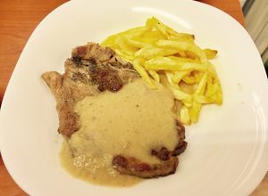 Foto principal de Chuletas con salsa de cebolla y coñac
