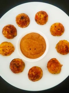 பச்சை மக்காச்சோள கார பணியாரம் (Raw Maize spicy paniyaram recipe in tamil) செய்முறை முக்கிய புகைப்படம்