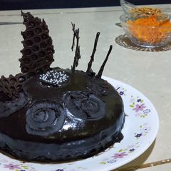 A picture of Dark Chocolate cake with homemade sauce.