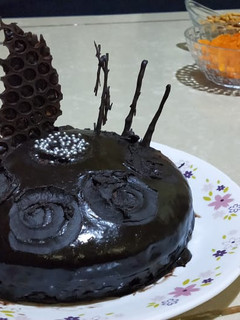 A picture of Dark Chocolate cake with homemade sauce.
